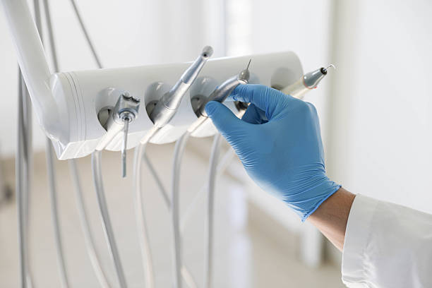Professional Tooth Extraction technician working in Bibb County County, GA